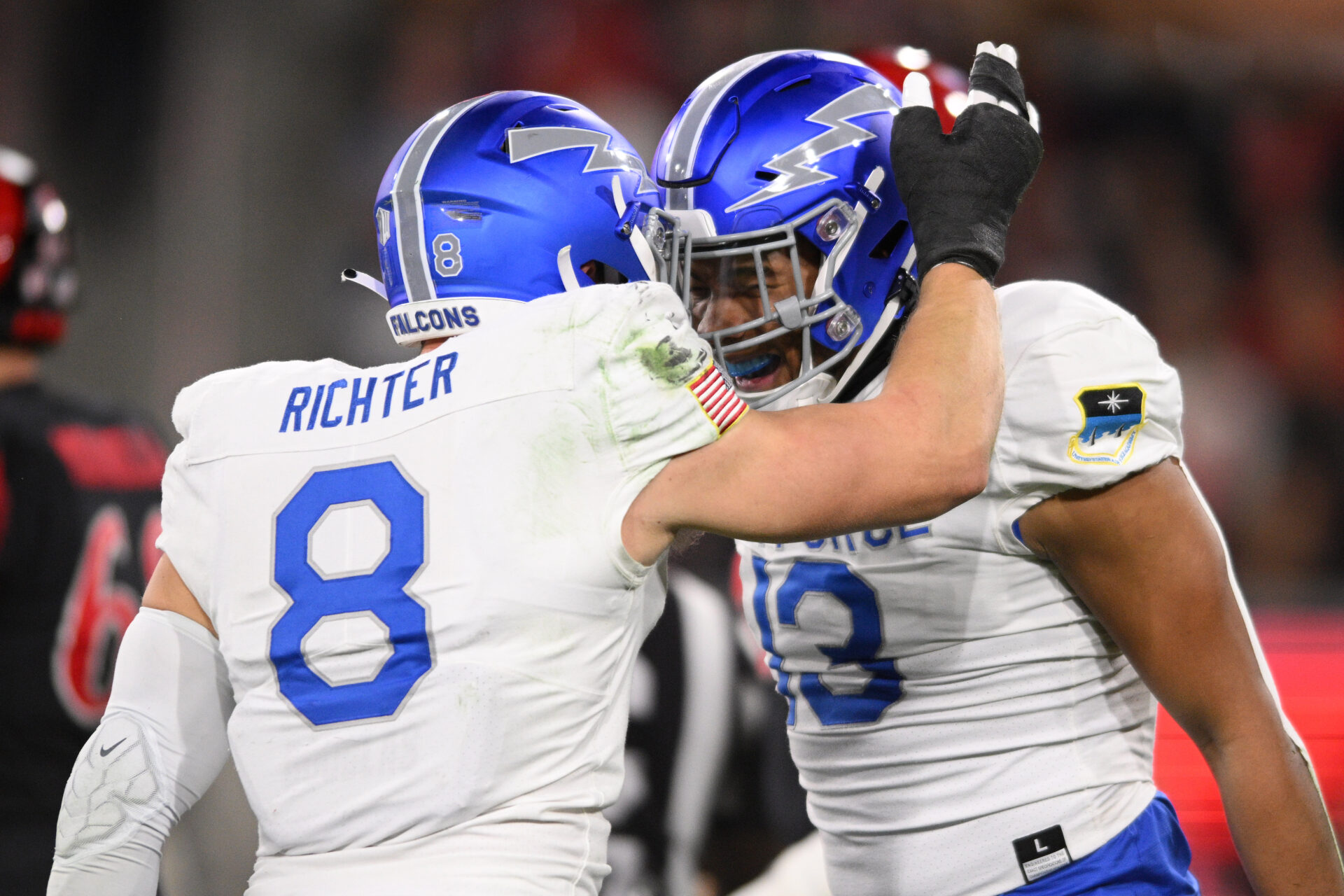 Air Force Falcons linebacker PJ Ramsey (13) is congratulated by linebacker Bo Richter (8) after sacking San Diego State Aztecs quarterback Jalen Mayden (18) during the first half at Snapdragon Stadium.