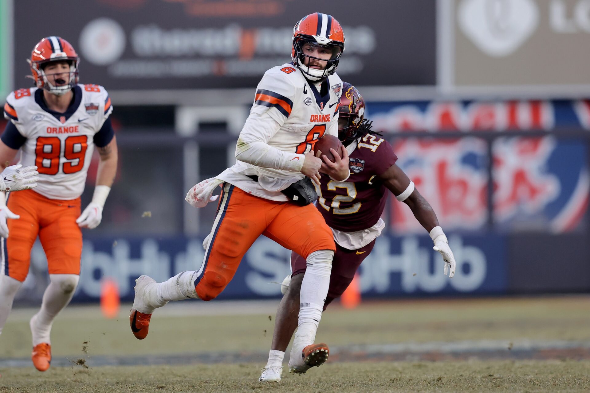 Syracuse QB Garrett Shrader runs the ball against Minnesota.