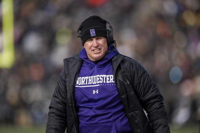 Pat Fitzgerald walks the sidelines during the second quarter against the Purdue Boilermakers.