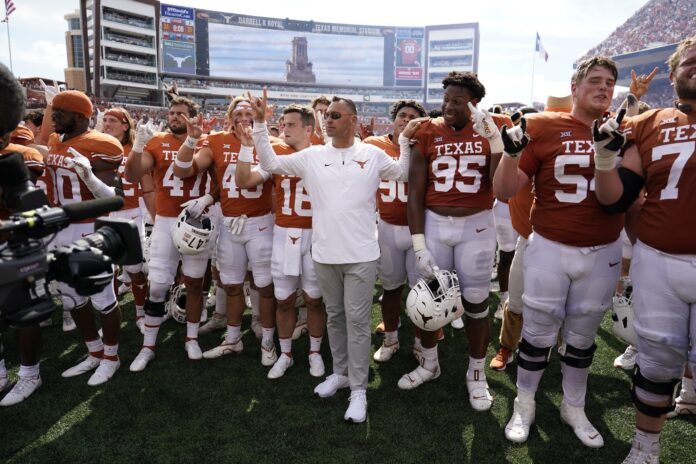 Steve Sarkisian and players join fans for The Eyes of Texas.