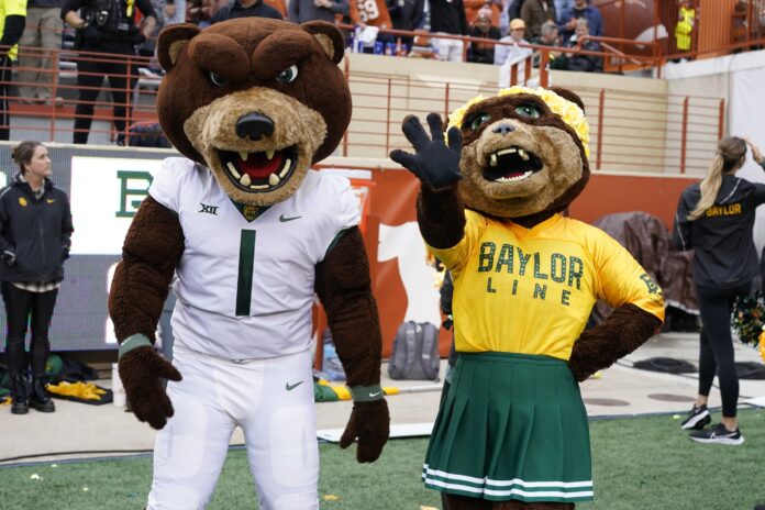 Baylor Bears mascots Bruiser and Marigold on the sidelines during a game.