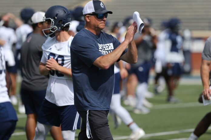 Georgia Southern head coach Clay Helton claps during the Eagles' spring practice.