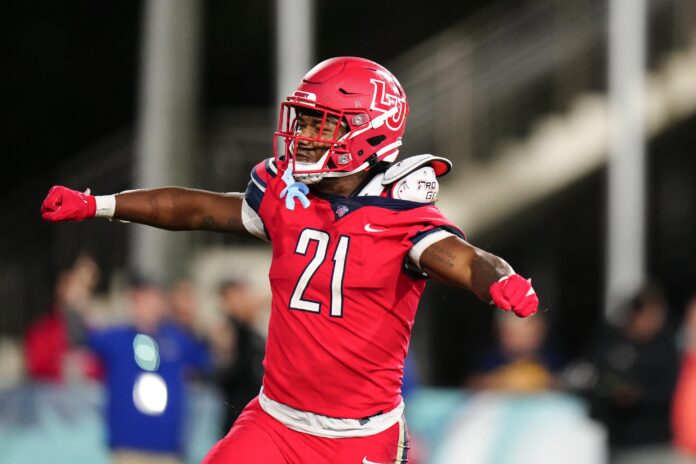 Liberty Flames wide receiver Treon Sibley (21) celebrates scoring a touchdown.