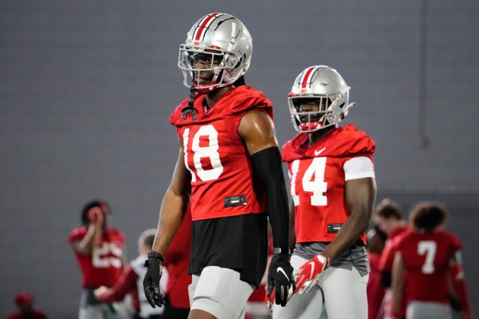 Ohio State WR Marvin Harrison Jr. (18) works out during spring practice.