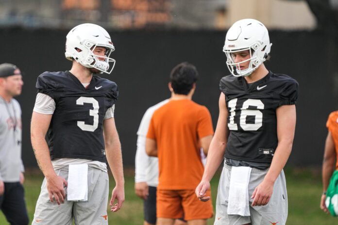 Quarterbacks Quinn Ewers (3) and Arch Manning (16) talk during the first Texas Longhorns football practice of 2023.