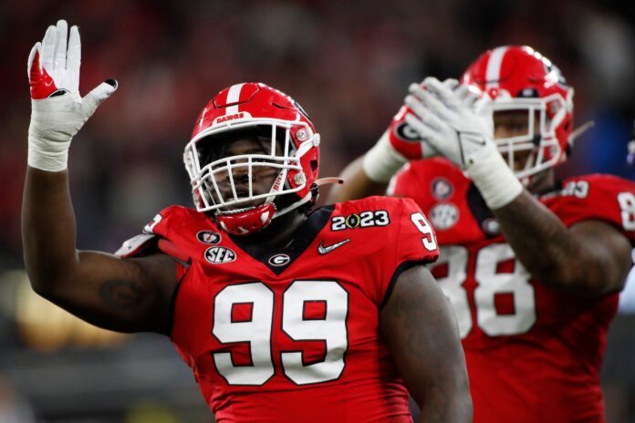 DL Bear Alexander (99) celebrates after a sack against TCU while with the Georgia Bulldogs.