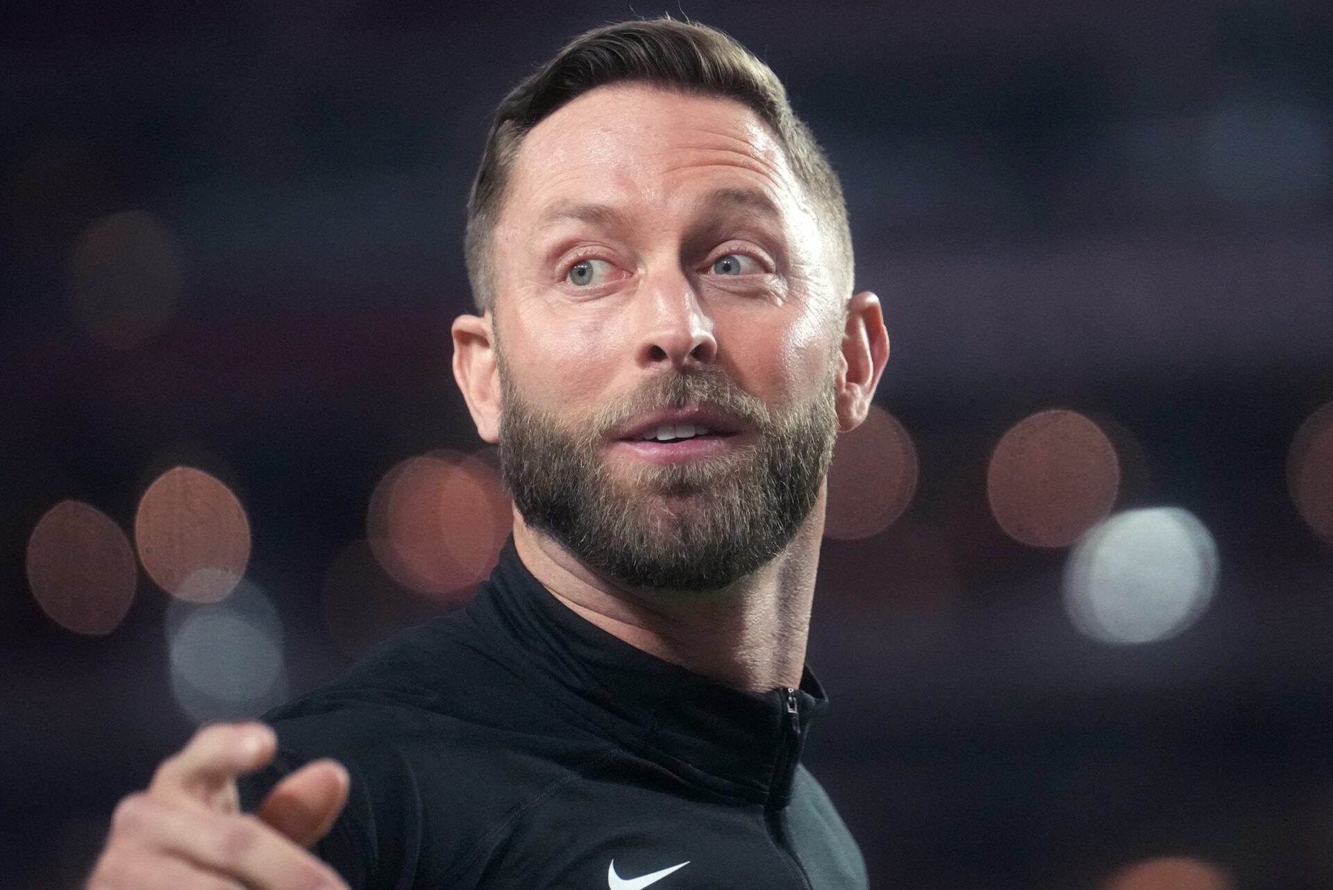 Former Arizona Cardinals head coach Kliff Kingsbury takes the field before a game.