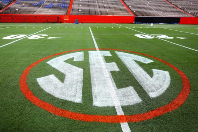 The SEC logo has a first coat of paint on the field at Ben Hill Griffin Stadium as the grounds crew prepares the field for the first game of the season, on the University of Florida campus in Gainesville FL. Sept. 1, 2022. The Gators start the season Saturday against the No. 7 ranked Utah Utes.