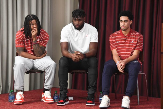 Alabama players (left to right) Jahmyr Gibbs, Will Anderson Jr., and Bryce Young speak during a press conference.