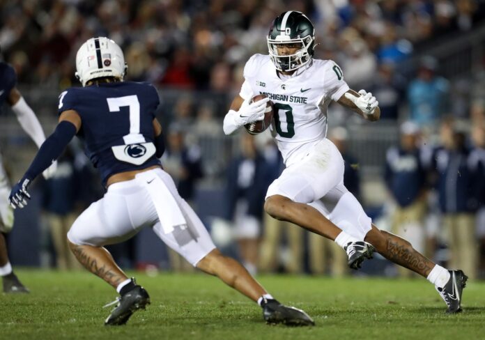 Michigan State WR Keon Coleman (0) runs the ball against Penn State.