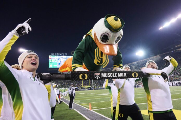 The Oregon Ducks mascot does push-ups after Oregon scored a touchdown.