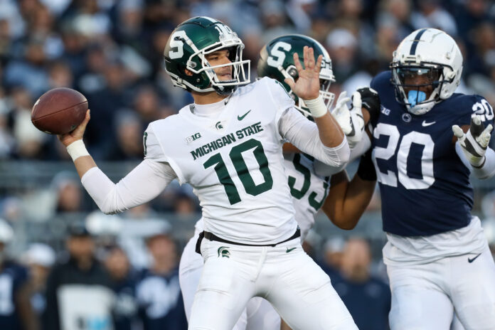Nov 26, 2022; University Park, Pennsylvania, USA; Michigan State Spartans quarterback Payton Thorne (10) throws a pass during the first quarter against the Penn State Nittany Lions at Beaver Stadium. Mandatory Credit: Matthew OHaren-USA TODAY Sports