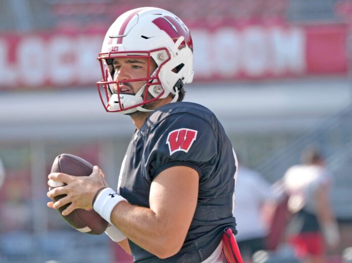 Wisconsin Badgers quarterback Tanner Mordecai (8) runs through a drill during fall training camp at Camp Randall Stadium in Madison on Thursday, Aug. 10, 2023.