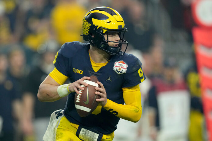 Dec 31, 2022; Glendale, Arizona, USA; Michigan Wolverines quarterback J.J. McCarthy (9) looks to throw against the TCU Horned Frogs in the first half of the 2022 Fiesta Bowl at State Farm Stadium. Mandatory Credit: Kirby Lee-USA TODAY Sports