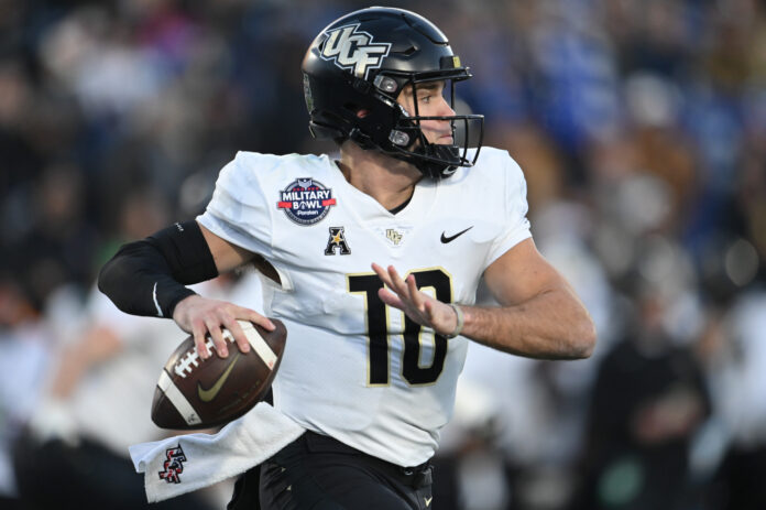 Central Florida Knights quarterback John Rhys Plumlee (10) throws own the run during the second half against the Duke Blue Devils in the 2022 Military Bowl at Navy-Marine Corps Memorial Stadium. Mandatory Credit: Tommy Gilligan-USA TODAY Sports