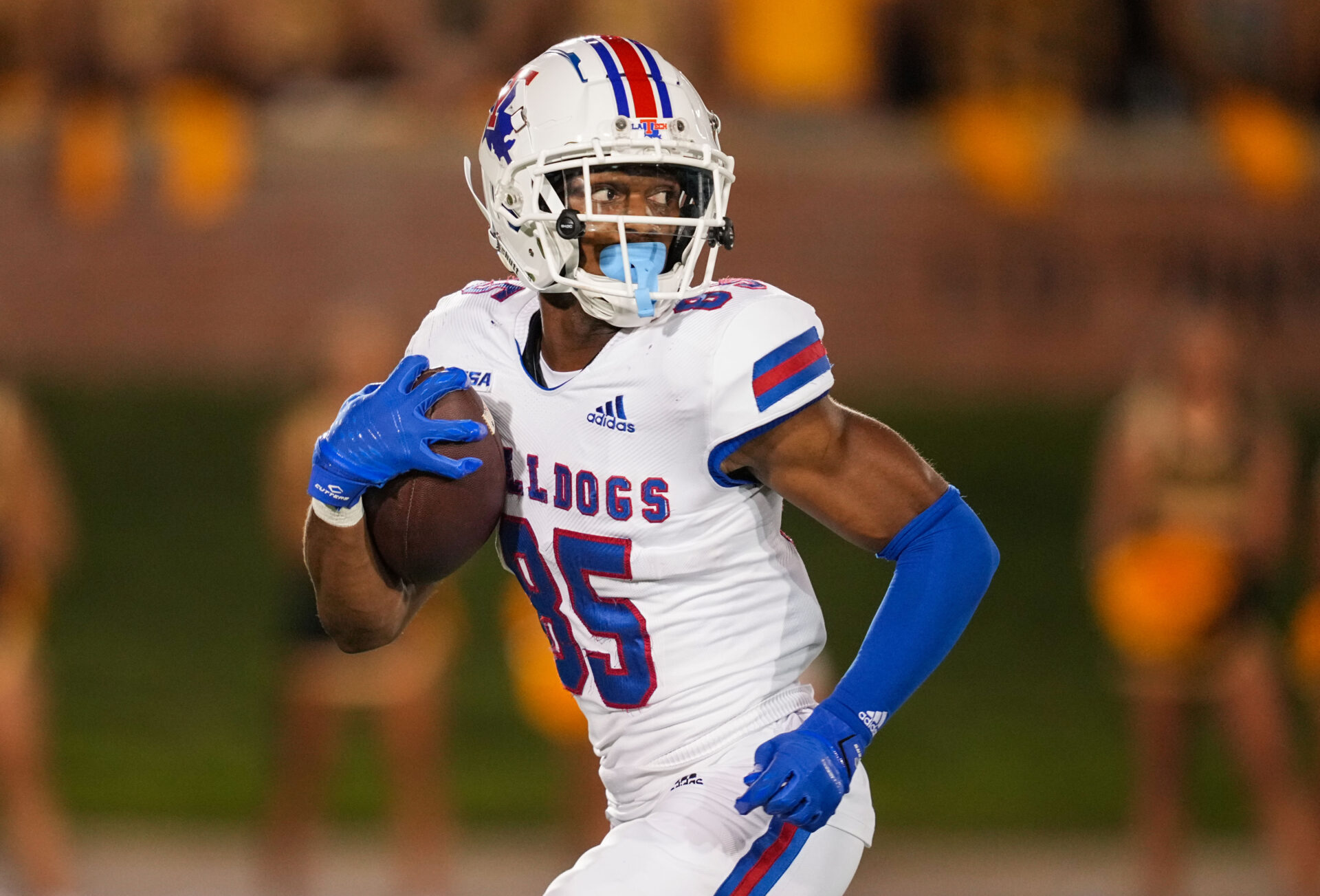 Louisiana Tech Bulldogs wide receiver Cyrus Allen (85) runs for a touchdown against the Missouri Tigers during the second half at Faurot Field at Memorial Stadium.