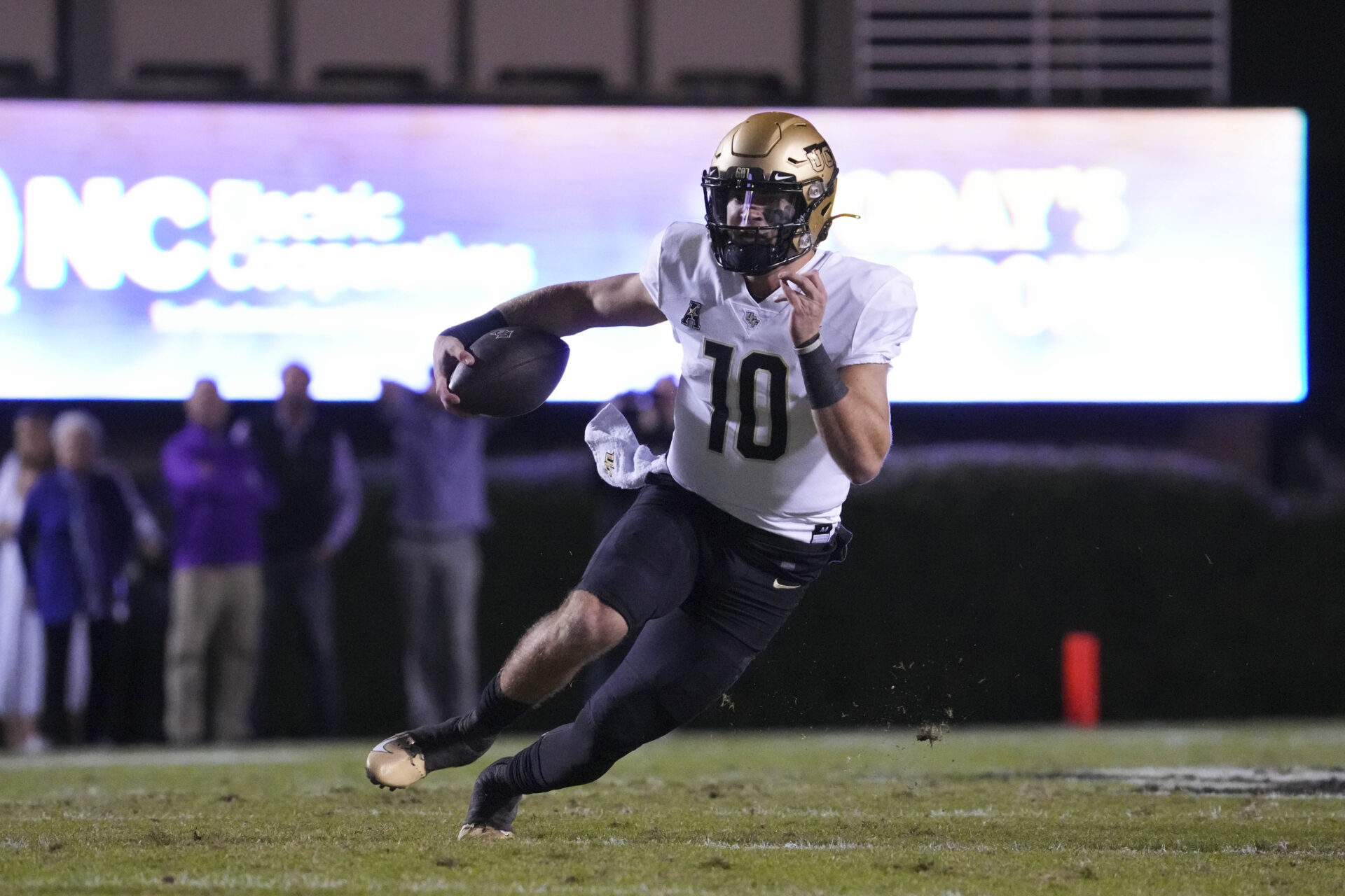 UCF Knights quarterback John Rhys Plumlee (10) runs with the ball against the East Carolina Pirates during the first half at Dowdy-Ficklen Stadium.