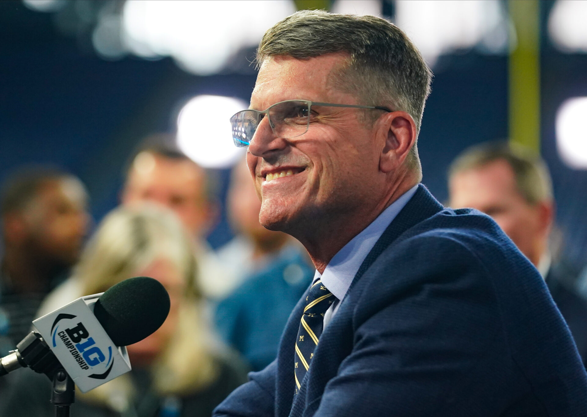 Michigan Wolverines head coach Jim Harbaugh speaks to the media during the Big 10 football media day at Lucas Oil Stadium.
