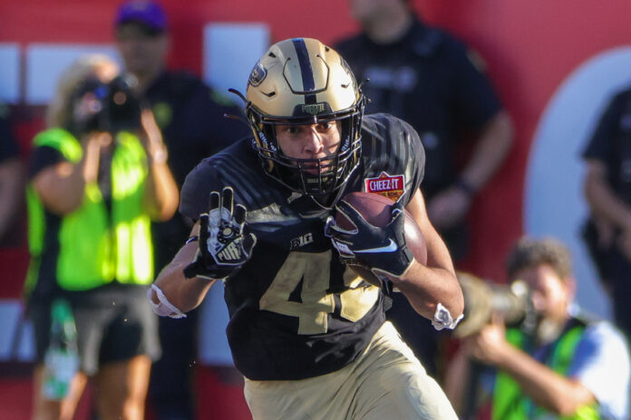 Jan 2, 2023; Orlando, FL, USA; Purdue Boilermakers running back Devin Mockobee (45) carries the ball during the second half against the Purdue Boilermakers at Camping World Stadium. Mandatory Credit: Mike Watters-USA TODAY Sports