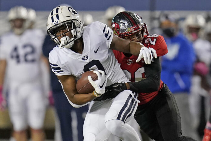 Oct 31, 2020; Provo, UT, USA; Western Kentucky defensive back Dionté Ruffin (26) tackles BYU wide receiver Kody Epps (0) in the second half of an NCAA college football game Saturday, Oct. 31, 2020, in Provo, Utah. Mandatory Credit: Rick Bowmer/Pool Photo-USA TODAY Sports
