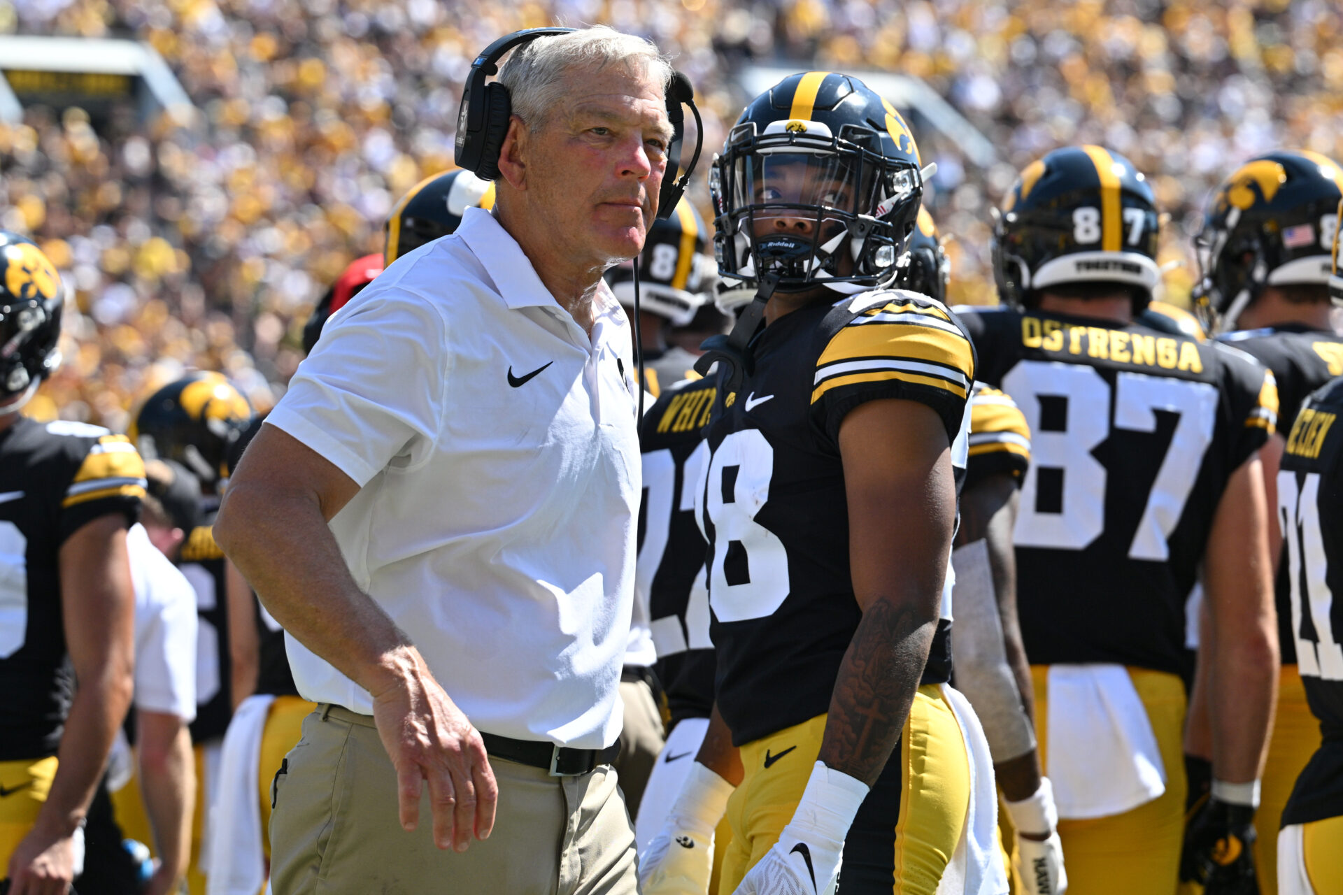 Sep 2, 2023; Iowa City, Iowa, USA; Iowa Hawkeyes head coach Kirk Ferentz and running back Kamari Moulton (28) look on during a timeout during the second quarter against the Utah State Aggies Kinnick Stadium. Mandatory Credit: Jeffrey Becker-USA TODAY Sports