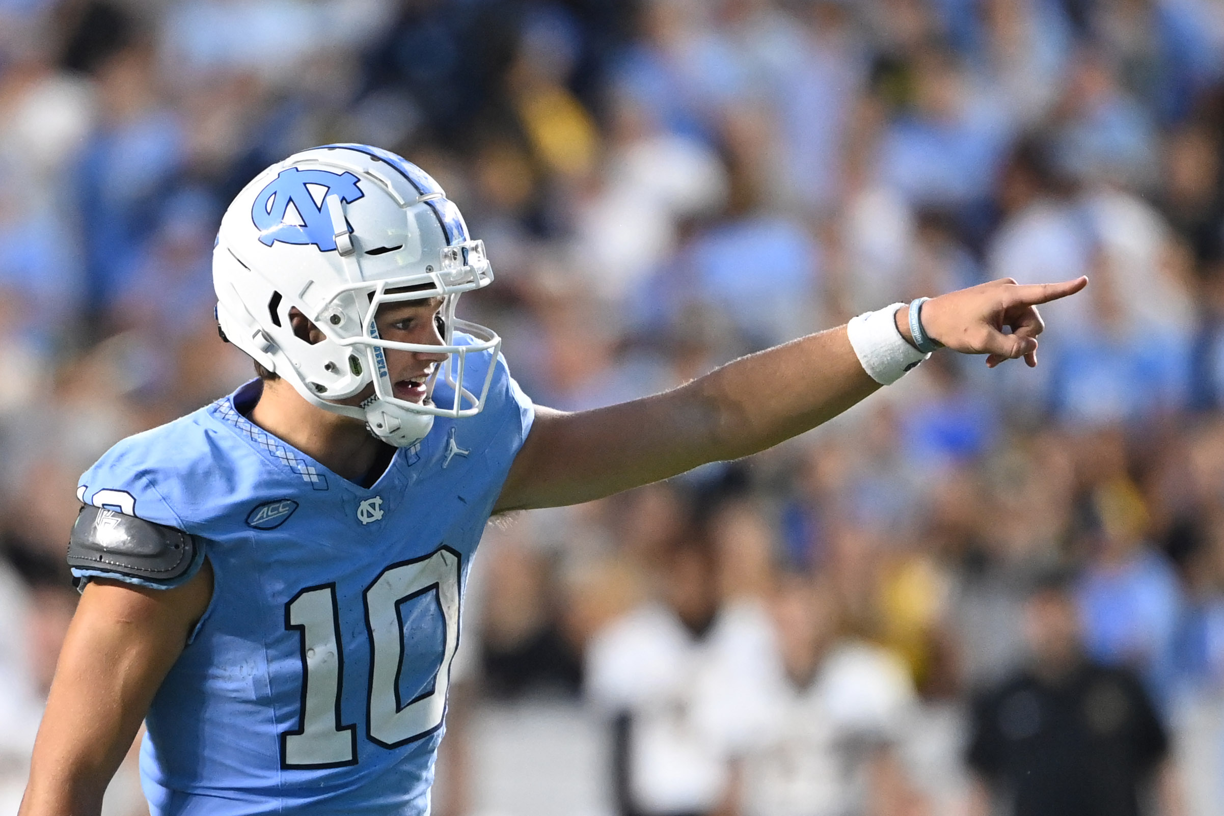 Projected top pick Drake Maye celebrates Sam Howell being named