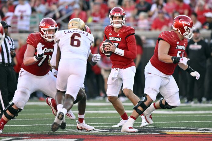 Louisville Cardinals quarterback Jack Plummer (13) looks to pass againt the Boston College Eagles during the second half at L&N Federal Credit Union Stadium. Louisville defeated Boston College 56-28.