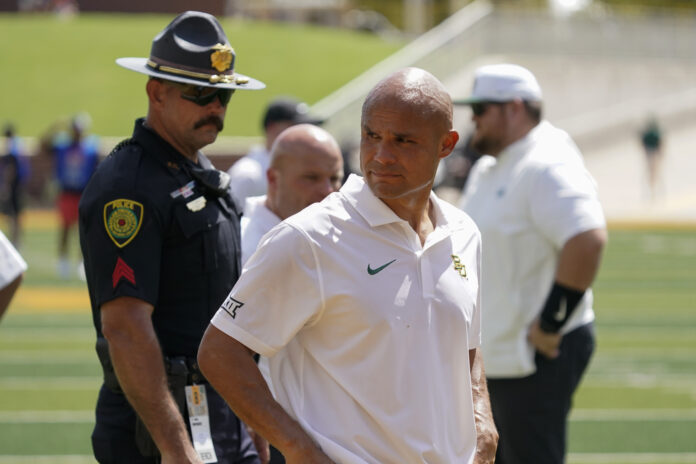 Baylor Bears head coach Dave Aranda leaves the field after the game against the Utah Utes at McLane Stadium.