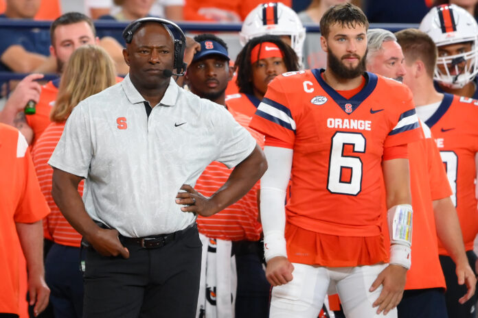 Syracuse Orange head coach Dino Babers (right) and quarterback Garrett Schrader (6) look on against the Western Michigan Broncos during the second half at the JMA Wireless Dome.