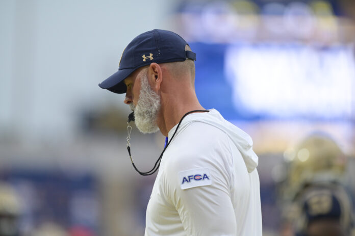 Navy Midshipmen head coach Brian Newberry walks the field before the game against the Wagner Seahawks at Navy-Marine Corps Memorial Stadium.