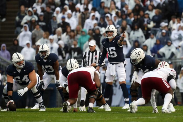 Penn State Nittany Lions quarterback Drew Allar (15) gestures from the line of scrimmage during the first quarter against the Massachusetts Minutemen.