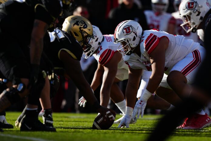 Utah Utes defensive tackle Simote Pepa (77) lines ups across from the Colorado Buffaloes in the first quarter at Folsom Field.