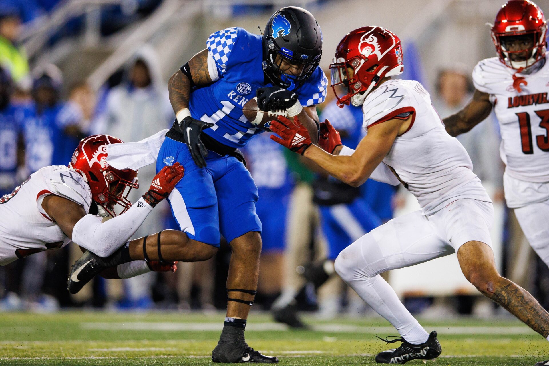 Kentucky Wildcats running back JuTahn McClain (17) carries the ball against the Louisville Cardinals during the third quarter at Kroger Field.