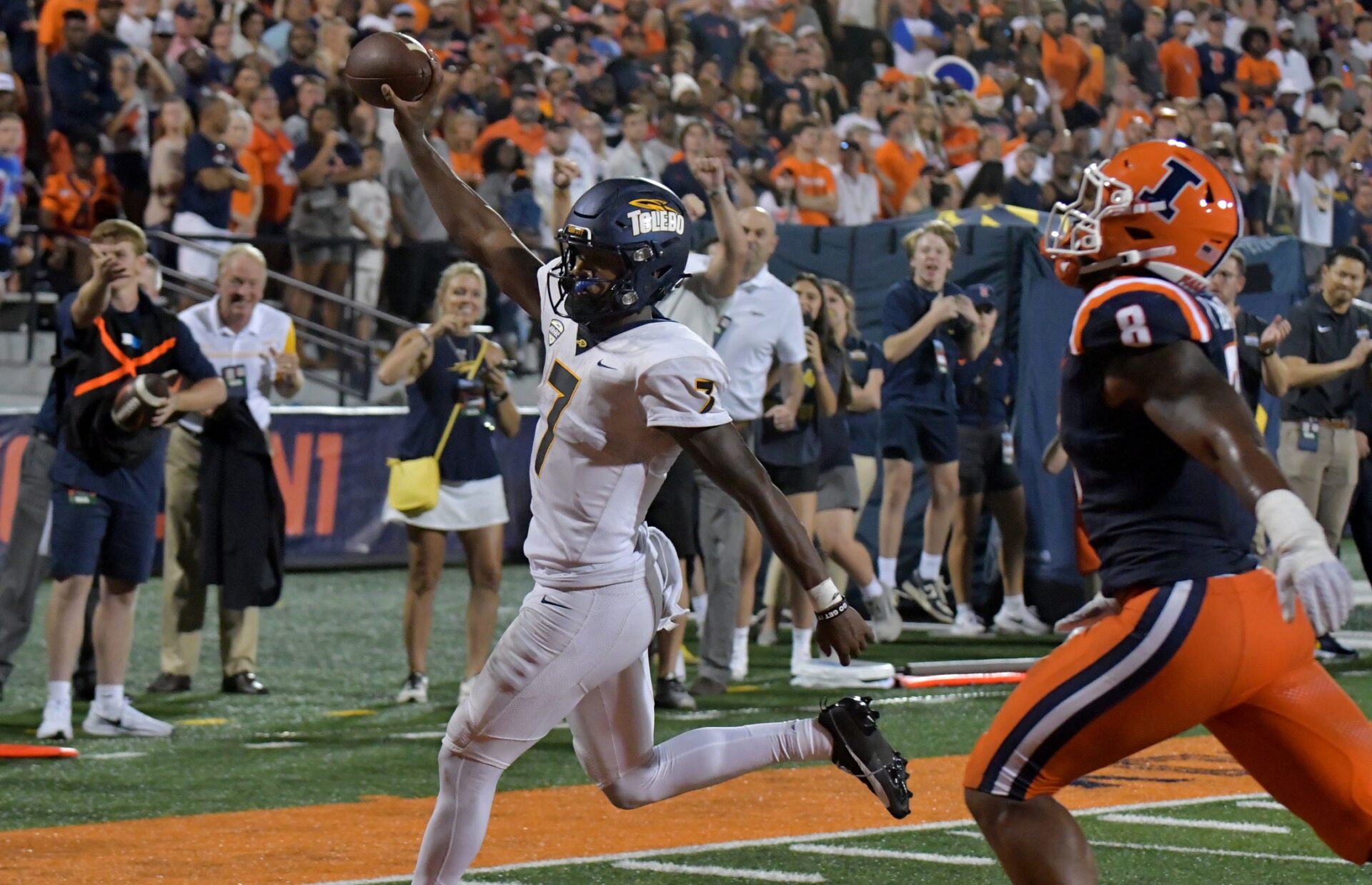 Toledo Rockets quarterback Dequan Finn (7) scores a touchdown in the second half against the Illinois Fighting Illini at Memorial Stadium.