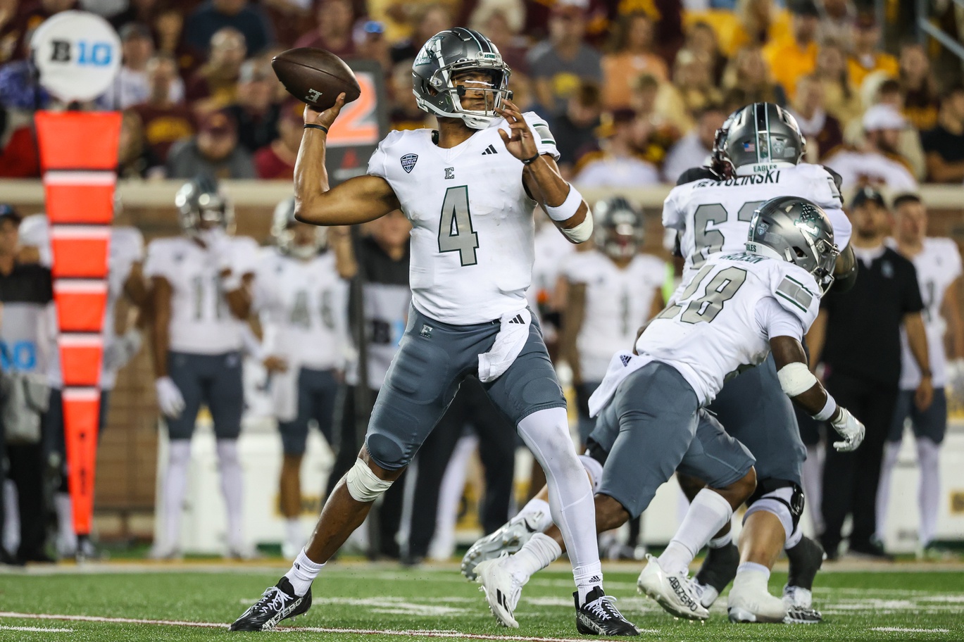 Eastern Michigan Eagles quarterback Austin Smith (4) passes against the Minnesota Golden Gophers during the third quarter at Huntington Bank Stadium.