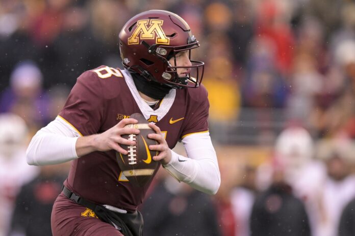 Minnesota Golden Gophers quarterback Athan Kaliakmanis (8) scrambles out of the pocket against the Wisconsin Badgers during the second quarter at Huntington Bank Stadium.