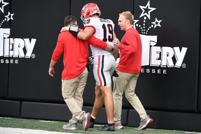 Georgia Bulldogs tight end Brock Bowers (19) walks off the field after an injury during the first half against the Vanderbilt Commodores.
