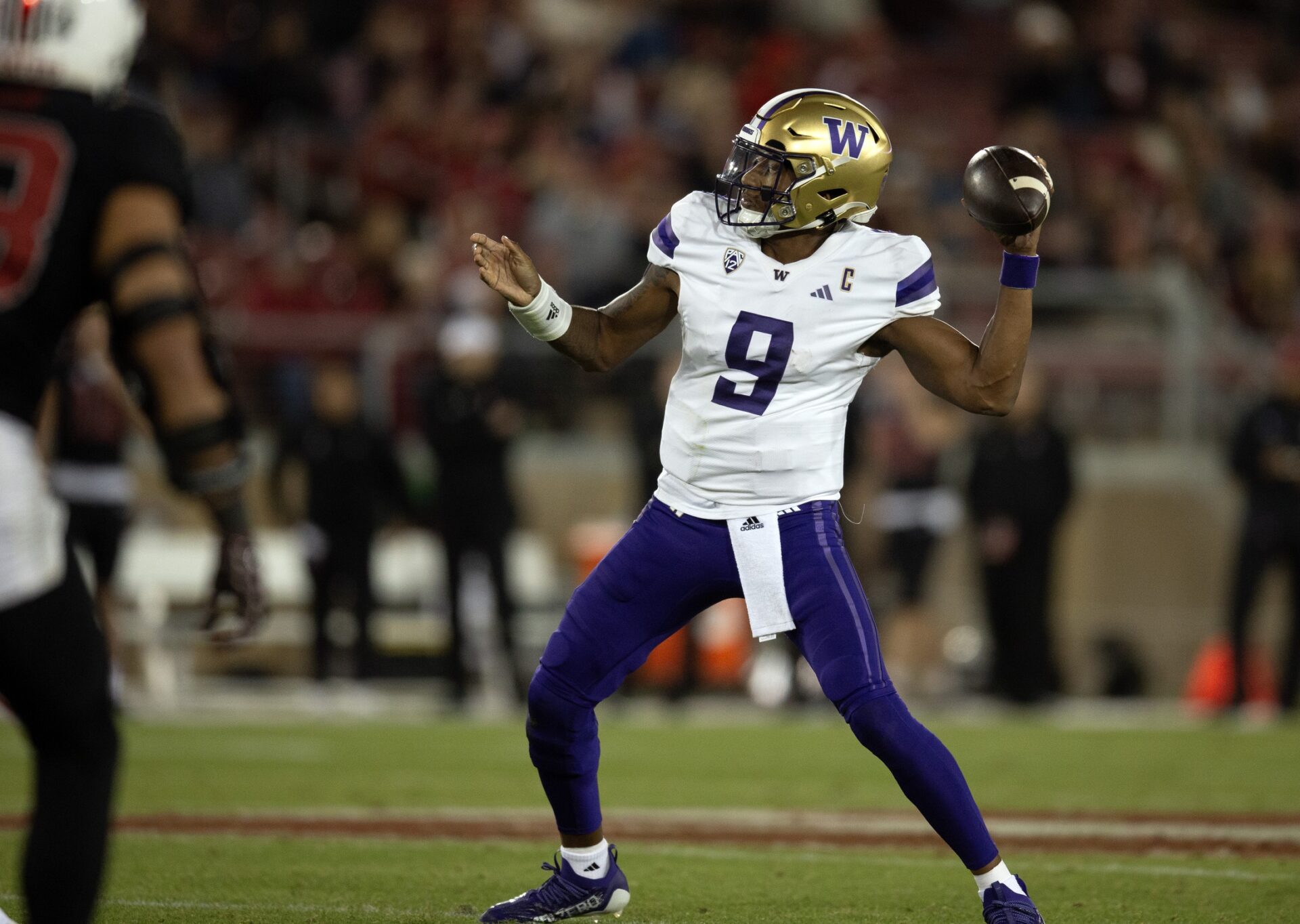 Washington Huskies quarterback Michael Penix Jr. (9) drops to pass against the Stanford Cardinal during the third quarter at Stanford Stadium.