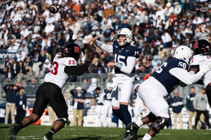 Penn State quarterback Drew Allar throws a checkdown pass to running back Kaytron Allen during an NCAA football game against Rutgers.