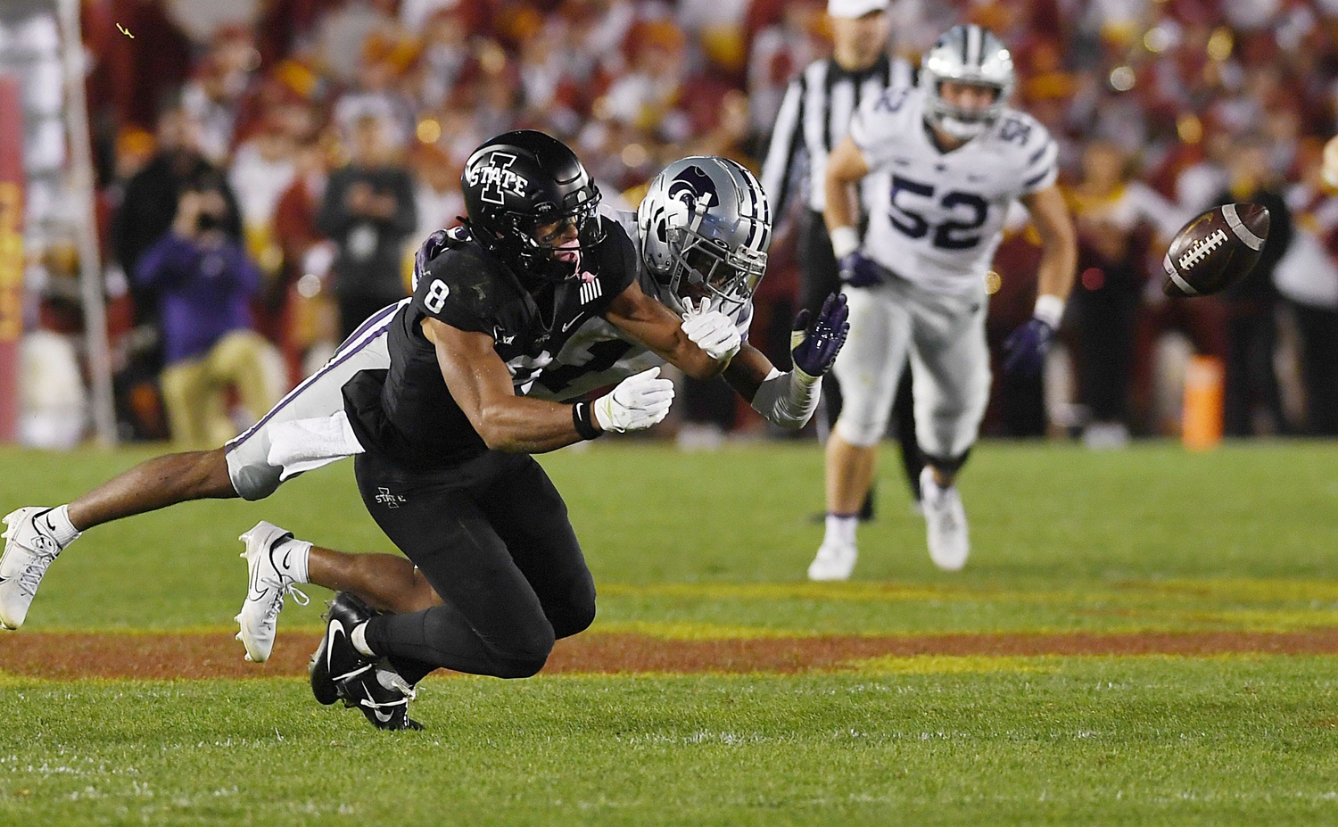 Kansas State Wildcats safety Josh Hayes (1) knocks out the ball from Iowa State Cyclones wide receiver Xavier Hutchinson (8).