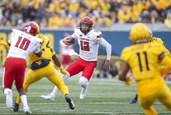 Texas Tech Red Raiders quarterback Tyler Shough (12) runs the ball during the first quarter against the West Virginia Mountaineers at Mountaineer Field.