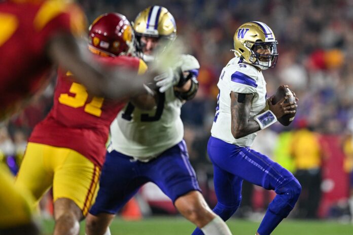 Washington Huskies quarterback Michael Penix Jr. (9) looks to pass against the USC Trojans during the fourth quarter at United Airlines Field.