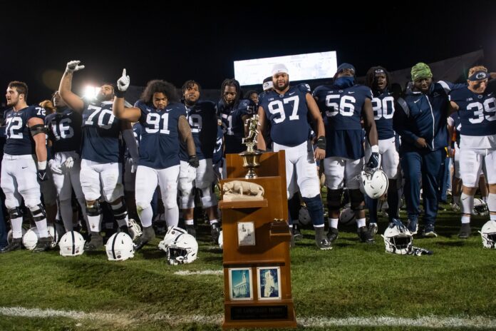 Penn State players sing the alma mater with the Land-Grant Trophy in front of them after defeating Michigan State, 35-16.