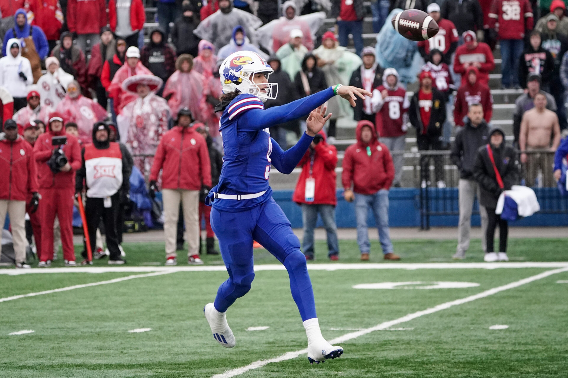 Kansas Jayhawks quarterback Jason Bean (9) throws a pass against the Oklahoma Sooners during the second half at David Booth Kansas Memorial Stadium.