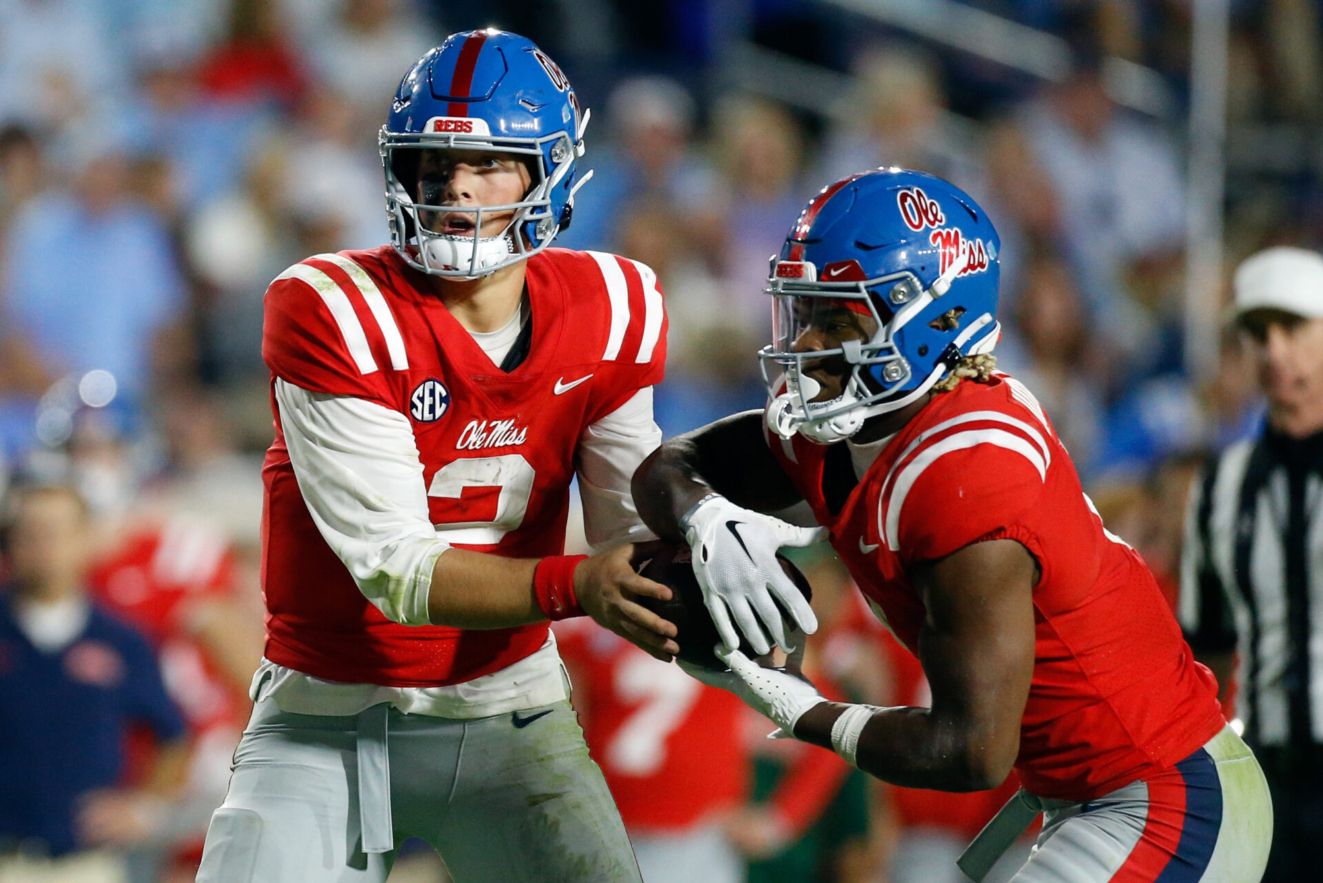 Mississippi Rebels quarterback Jaxson Dart (2) hands the ball off to Mississippi Rebels running back Quinshon Judkins (4) during the second half against the Vanderbilt Commodores at Vaught-Hemingway Stadium.