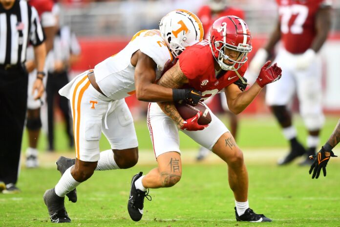 Alabama wide receiver Jermaine Burton (3) is tackled by Tennessee defensive back Jaylen McCollough (2) during an NCAA college football game between Tennessee and Alabama.