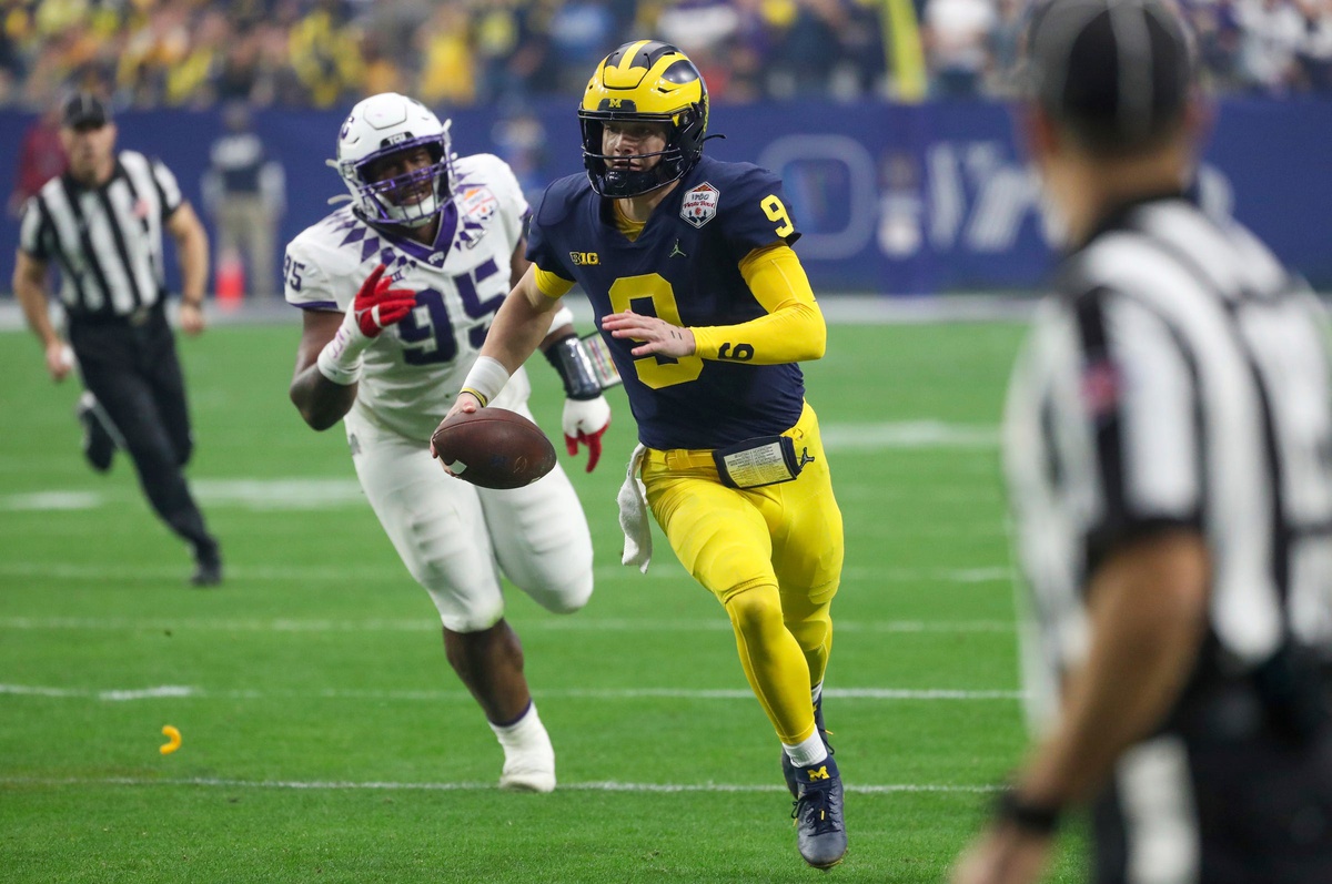 Michigan quarterback J.J. McCarthy runs the ball in the first quarter of the Fiesta Bowl vs. TCU.