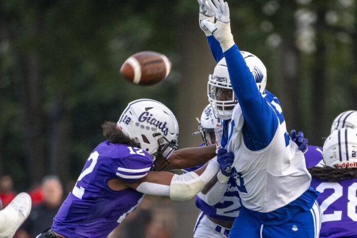 IMG Academy High School senior David Stone (90) attempts to block a punt during the first half of an IHSAA varsity football game against Ben Davis High School.