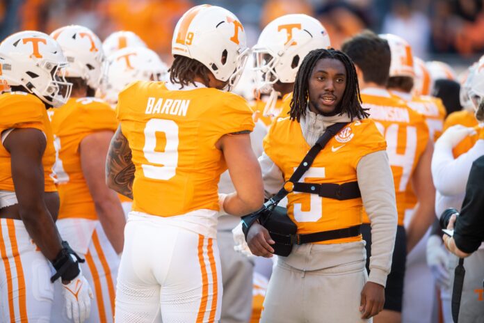Tennessee defensive lineman Tyler Baron (9) and Tennessee defensive back Kamal Hadden (5) before a football game between Tennessee and Georgia at Neyland Stadium.
