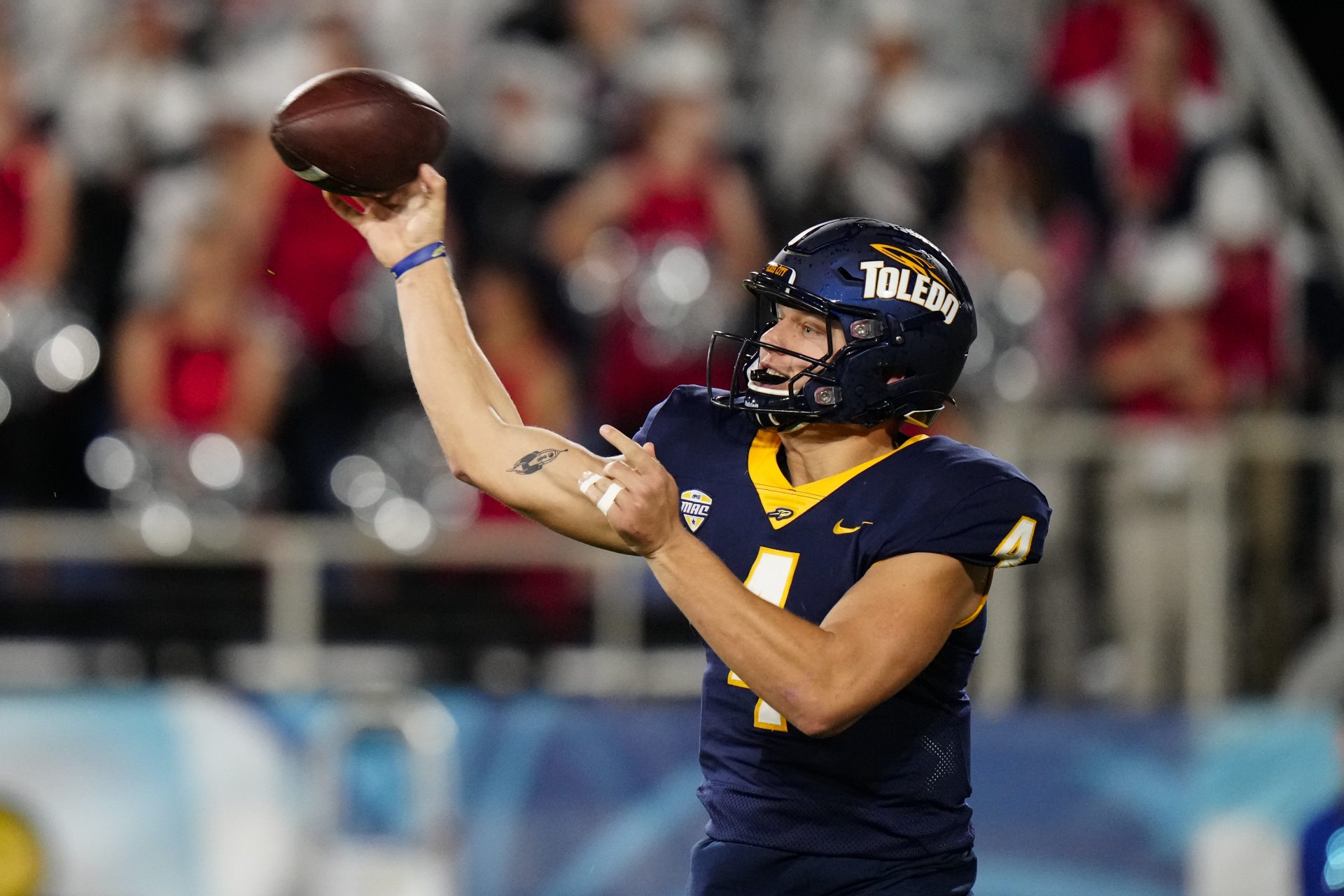 Toledo Rockets quarterback Tucker Gleason (4) throws a pass against the Liberty Flames during the second quarter in the 2022 Boca Raton Bowl at FAU Stadium.